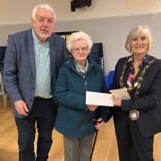 Former chair of Llandybie Community Council Carey Thomas (right) has listed six ways that life has improved for the community.