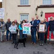 Members of the Salem Gar group, pictured with Mid and West Wales MS Cefin Campbell, are trying to take over The Angel Inn in Salem