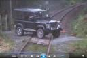 A Ffairfach driver had a narrow escape after his Landrover was struck by a passing train.
