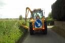 County council staff will be cutting grass verges the equivalent distance from Ammanford to the centre of the Earth