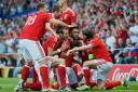 The Wales players celebrate a goal against Russia in Euro 2016.
