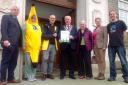 Fair Trade campaigners celebrating Carmarthenshire's Fair Trade County status outside County Hall