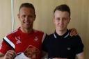 Guest of honour at Coleg Sir Gar, Lee Trundle, presenting competition winner Cory Gleaves with a signed Swans shirt.