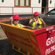 Staff at Gavin Griffiths Group cool down in one of their skips  Picture: Twitter @group_griffiths