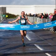 Carmarthenshire runner Dewi Griffiths crosses the finish line