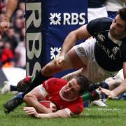 Shane Williams - pictured scoring against Scotland - has been named amongst the top Welsh sportspeople of the 21st century.