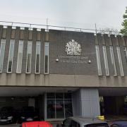 A woman has appeared at Llanelli Magistrates' Court accused of assaulting her partner and criminal damage.
