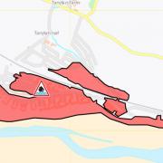 A flood warning has been issued for properties near Carmarthen Bay Holiday Village.