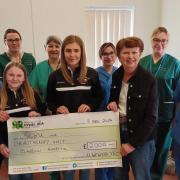 Llanfynydd Young Farmers Club donated £2,000 between the two departments