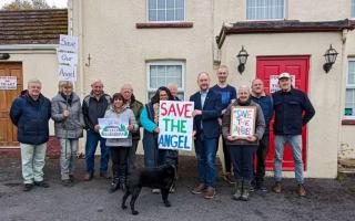 Members of the Salem Gar group, pictured with Mid and West Wales MS Cefin Campbell, are trying to take over The Angel Inn in Salem
