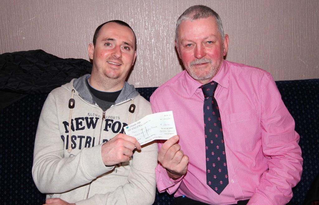 Paul Pugh receives a cheque from Hayden Morgan. Pic: SDD