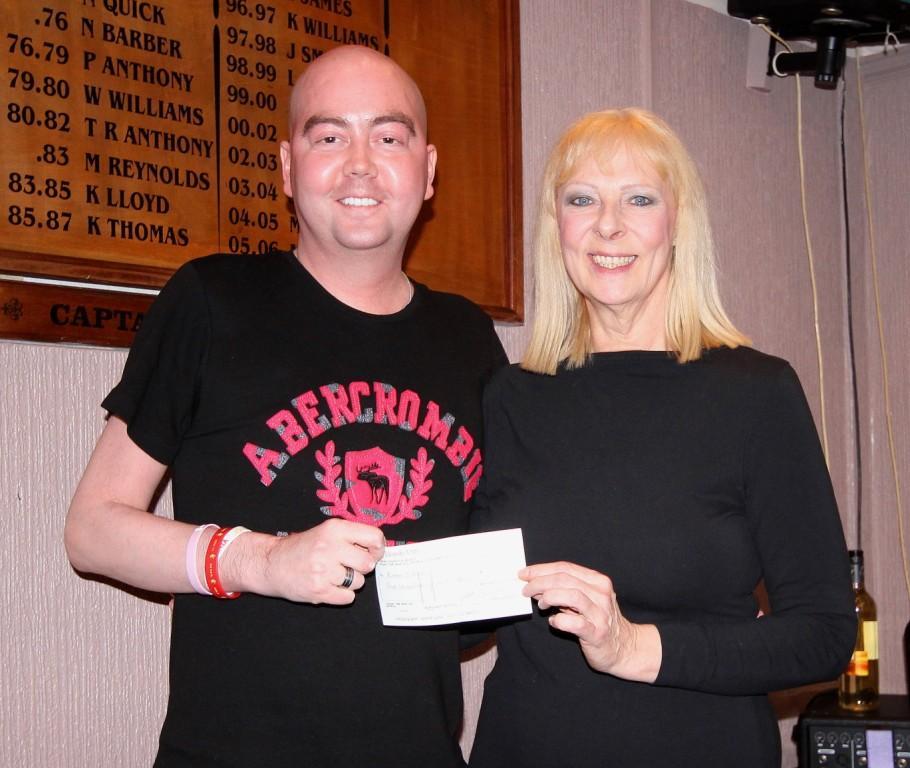 Ryan Davies of RYAN$LEUKEMIA receives a cheque from Barbara Bush. Pic: SDD