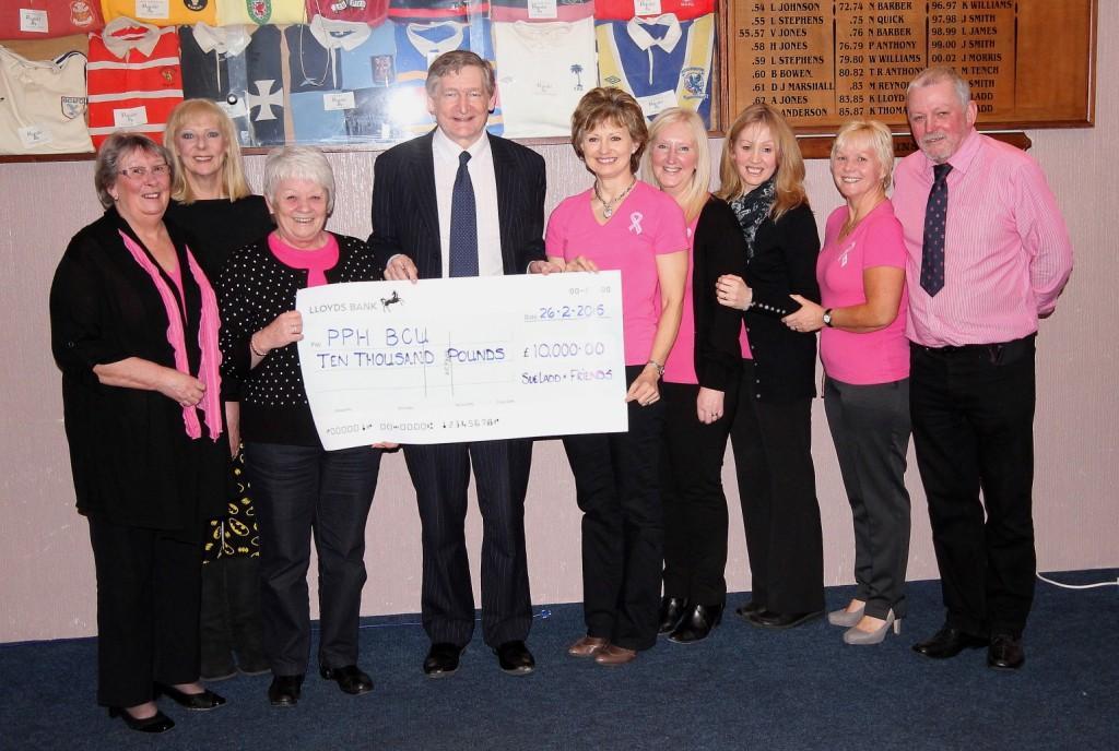 Mr Holt from Prince Philip Hospital receives a cheque for £10,000 again this year. Sue has now raised more than £100,000 for the hospital’s Breast Care Unit. Pic: SDD