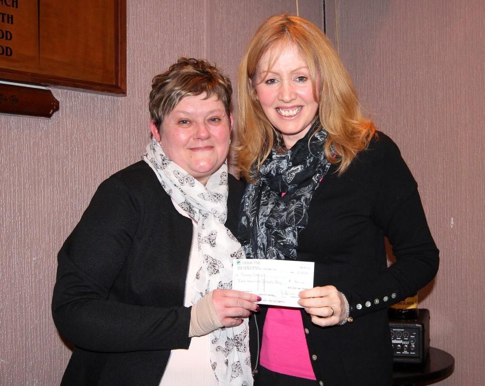Tracey Daniel, diagnosed with a brain tumour five years ago, went into remission but has relapsed, received a cheque for travelling costs from Alison Llewellyn. Pic: SDD