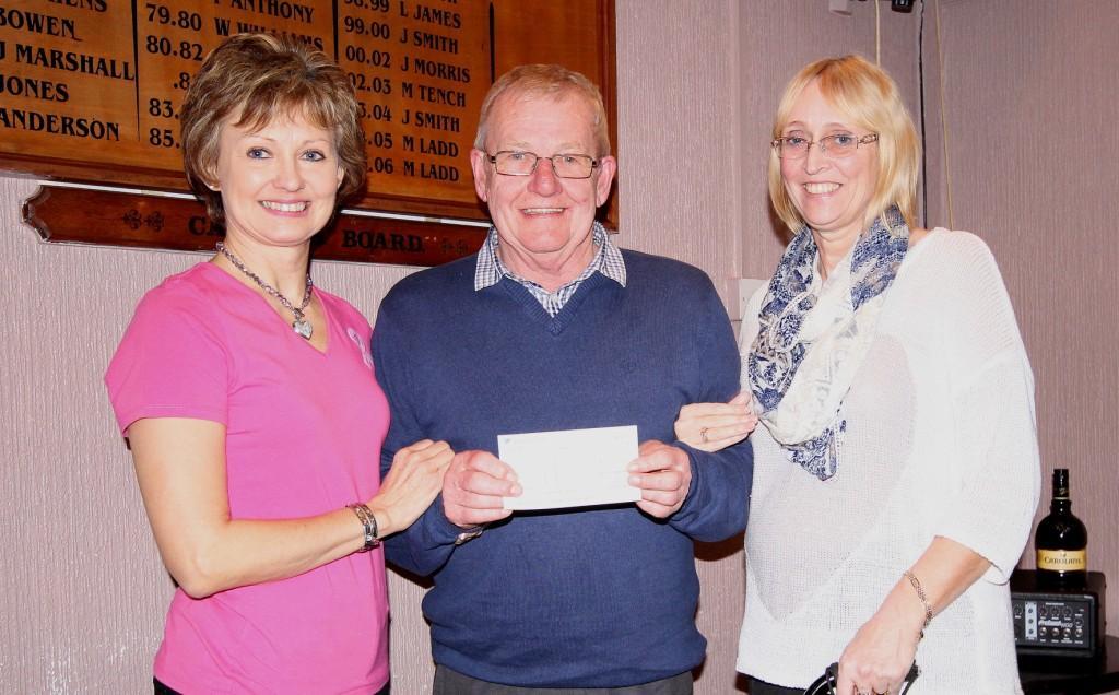 Sue presents a cheque for £750 to the Ammanford Stroke Society. Pic: SDD