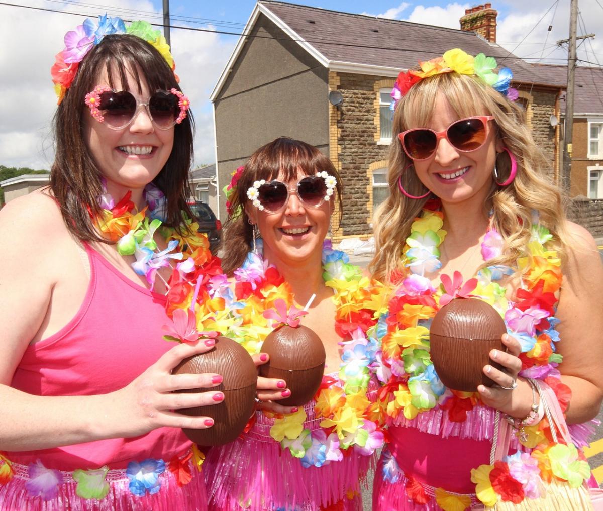 Colourful trio Petra Howells, Gail Williams and Helen Rainford say cheers at the Sue Ladd and Friends Pink Ribbon Race. Pic: SDD