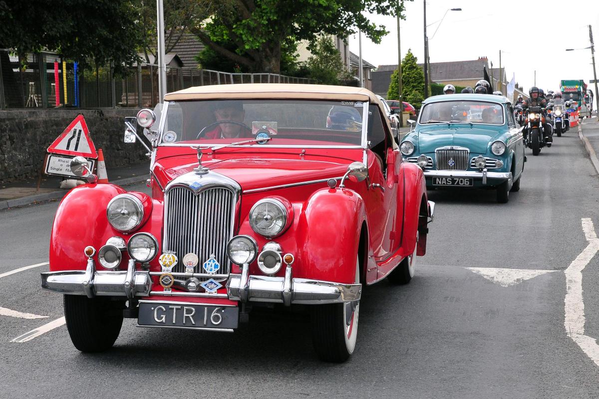 A Riley RMC Roadster is one the the classic cars leading the Gorslas Carnival parade.  Picture by Mark Davies