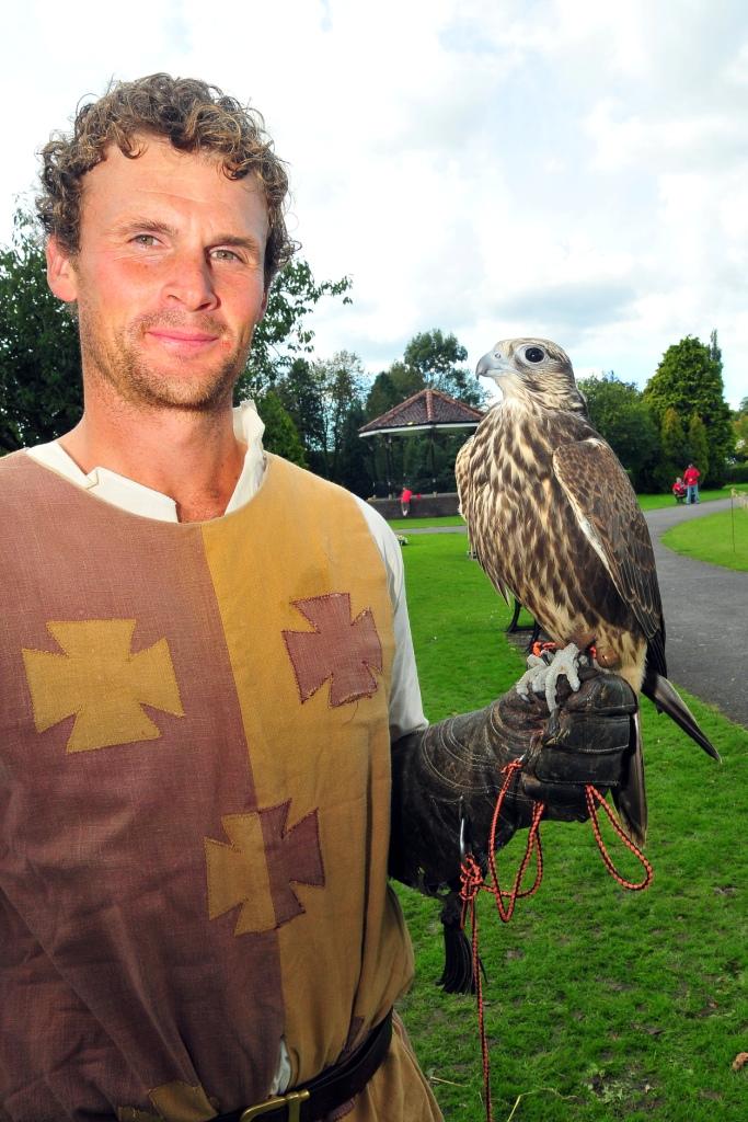 Alex Hill from Pembrokeshire Falconry with Mocha the young Sakia Falcon.  Picture by Mark Davies