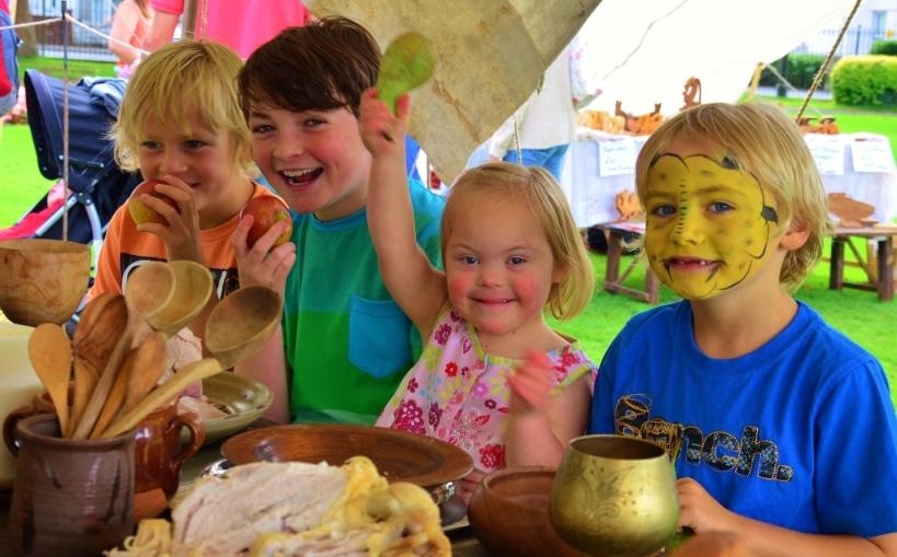 Casper Wiley age 10, Jay Roberts age 10, Tilly Roberts age 4 and Elijah Wiley age 6, from Tycroes get stuck in to some Medieval fayre. Pic: Melissa Lewis.