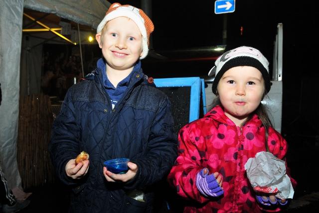 Siblings Joe (7) and Keira Rule (5) enjoy a hot snack at Llandeilo Festival of the Senses.  Picture by Mark Davies
