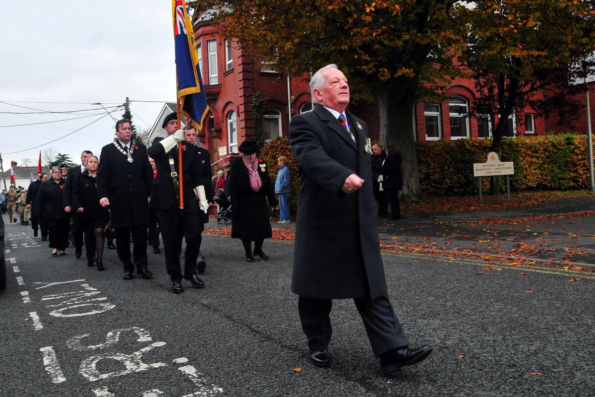 Major Ken Burton, president of the Ammanford branch of the Royal British Legion leads the Memorial Parade towards the church.   Picture by Mark Davies