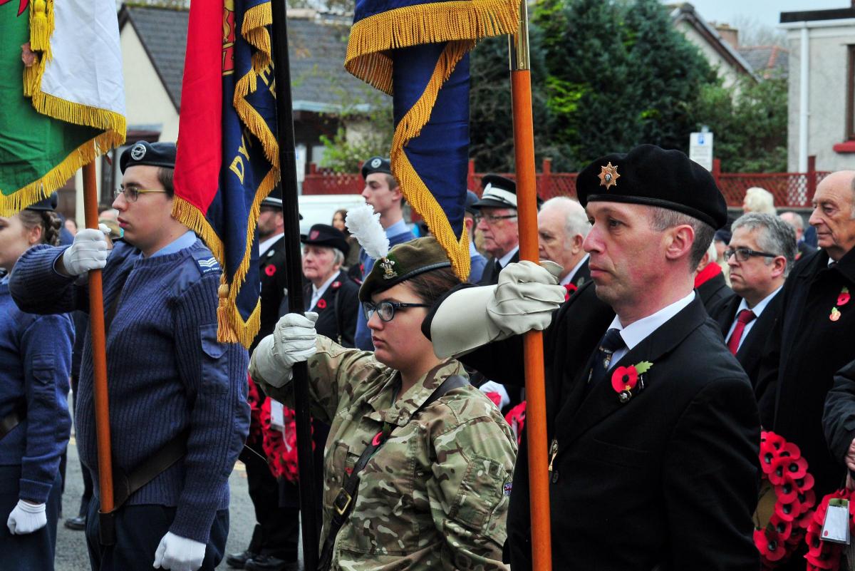 - Standard bearers salute the Last Post.   Picture by Mark Davies