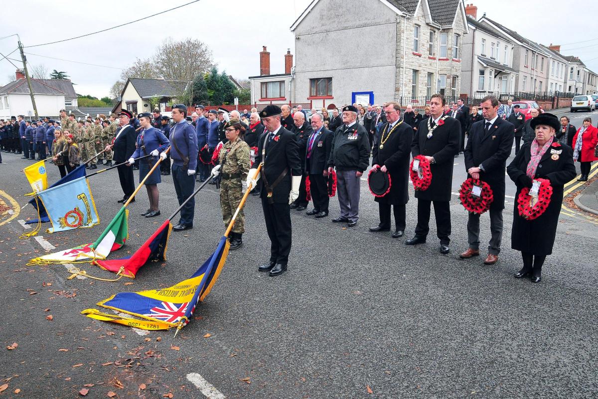 Standards are lowered during the two minute silence to mark the Act of Remembrance Picture: Mark Davies