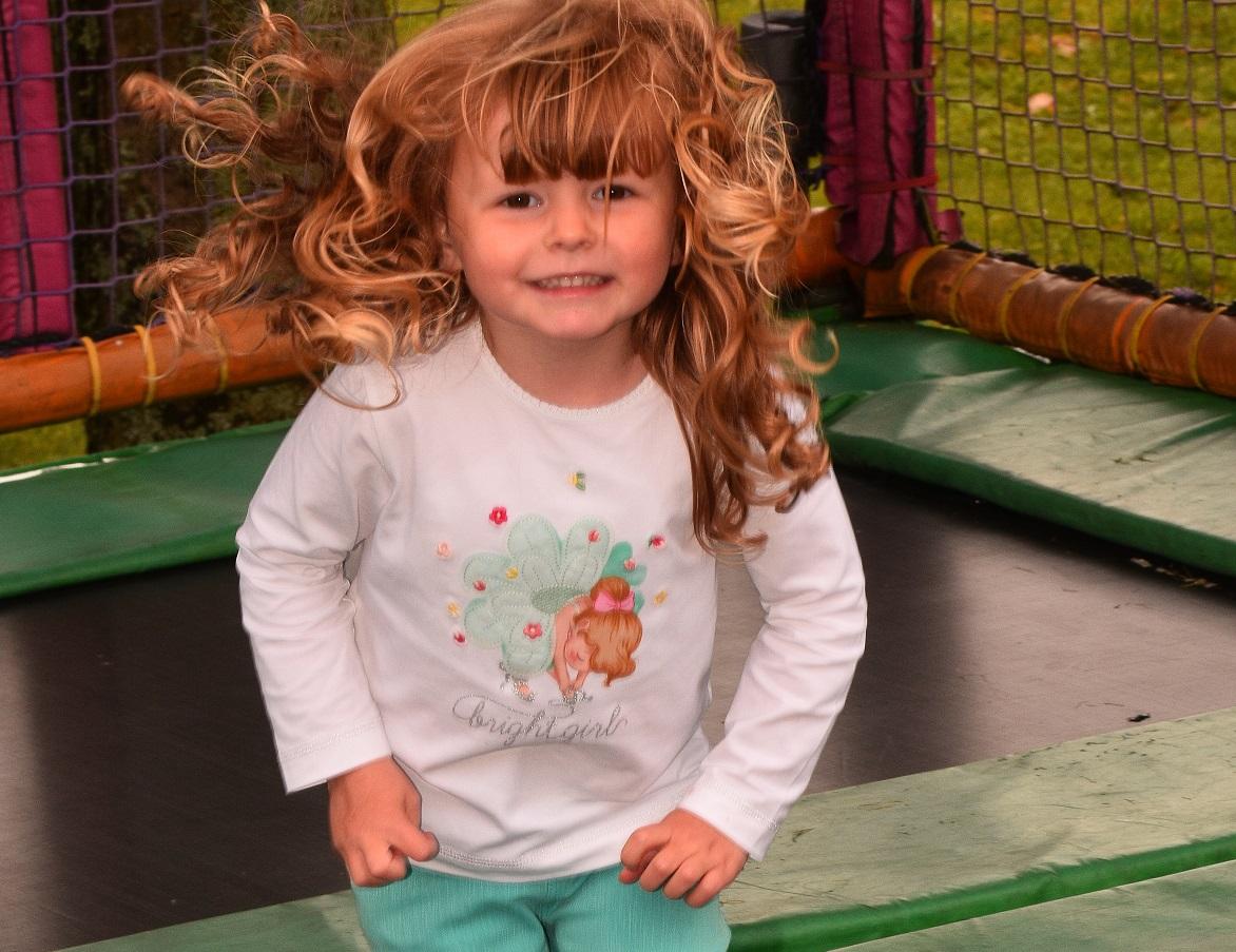 Three year old Lilli-Beth Williams has fun on the trampolines.