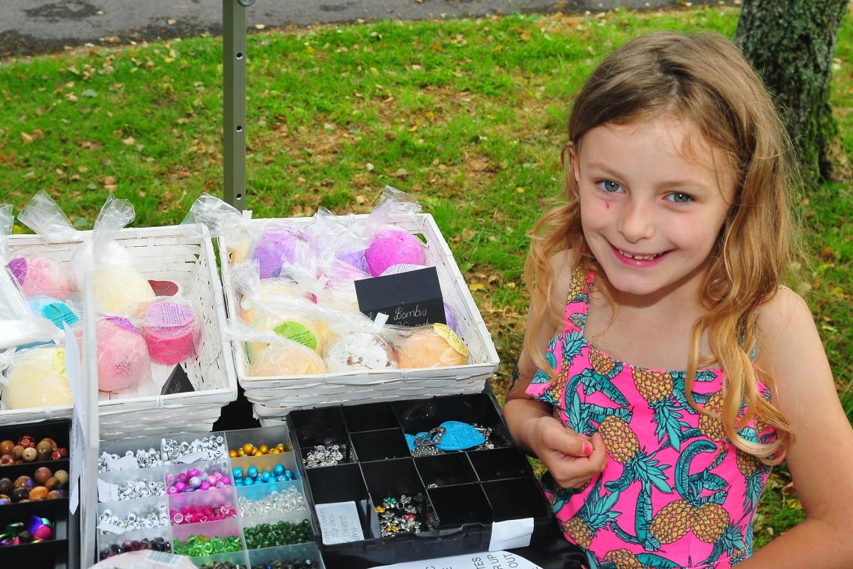 Five year old Eva Fuge pics out the items she likes at the jewellery stall.