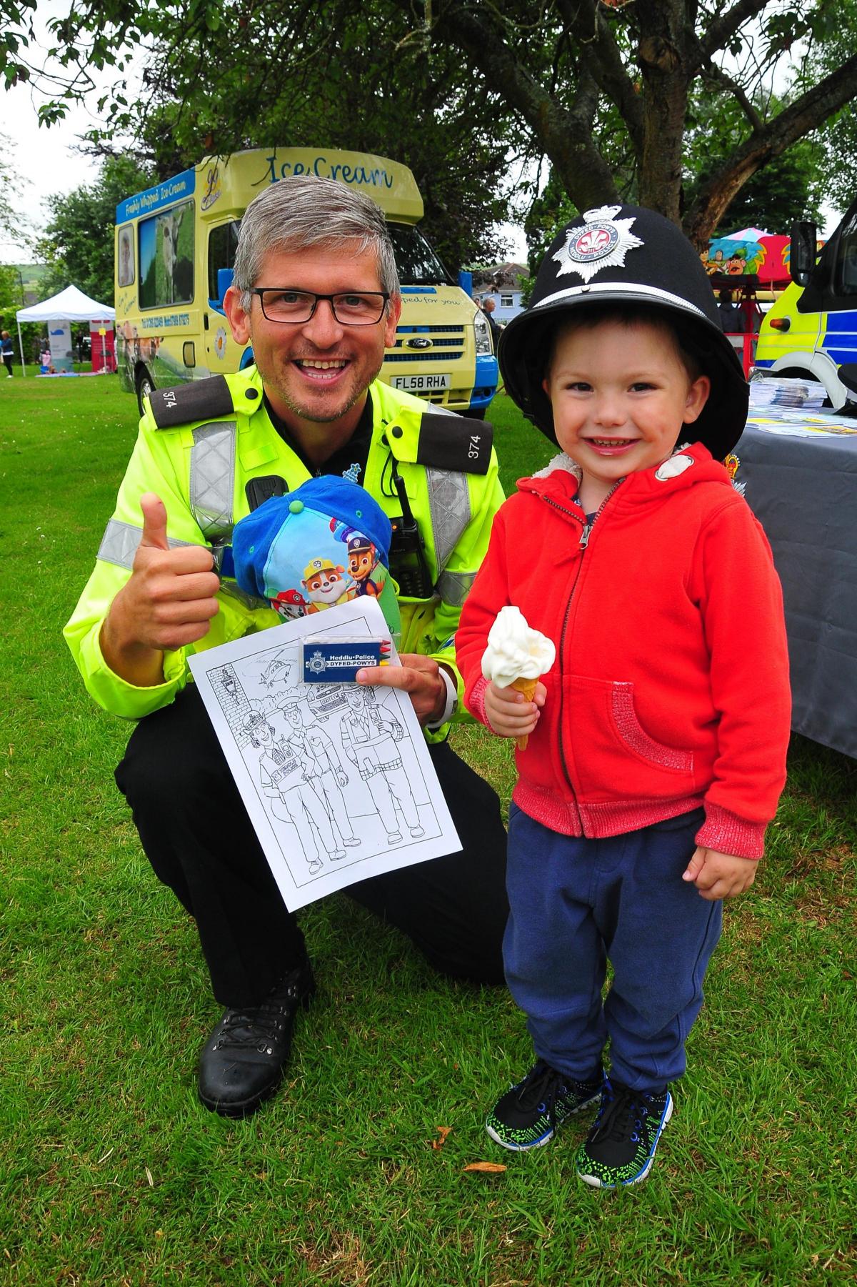Three year old Vinny Cannings joins forces with PC Stephen Morris.