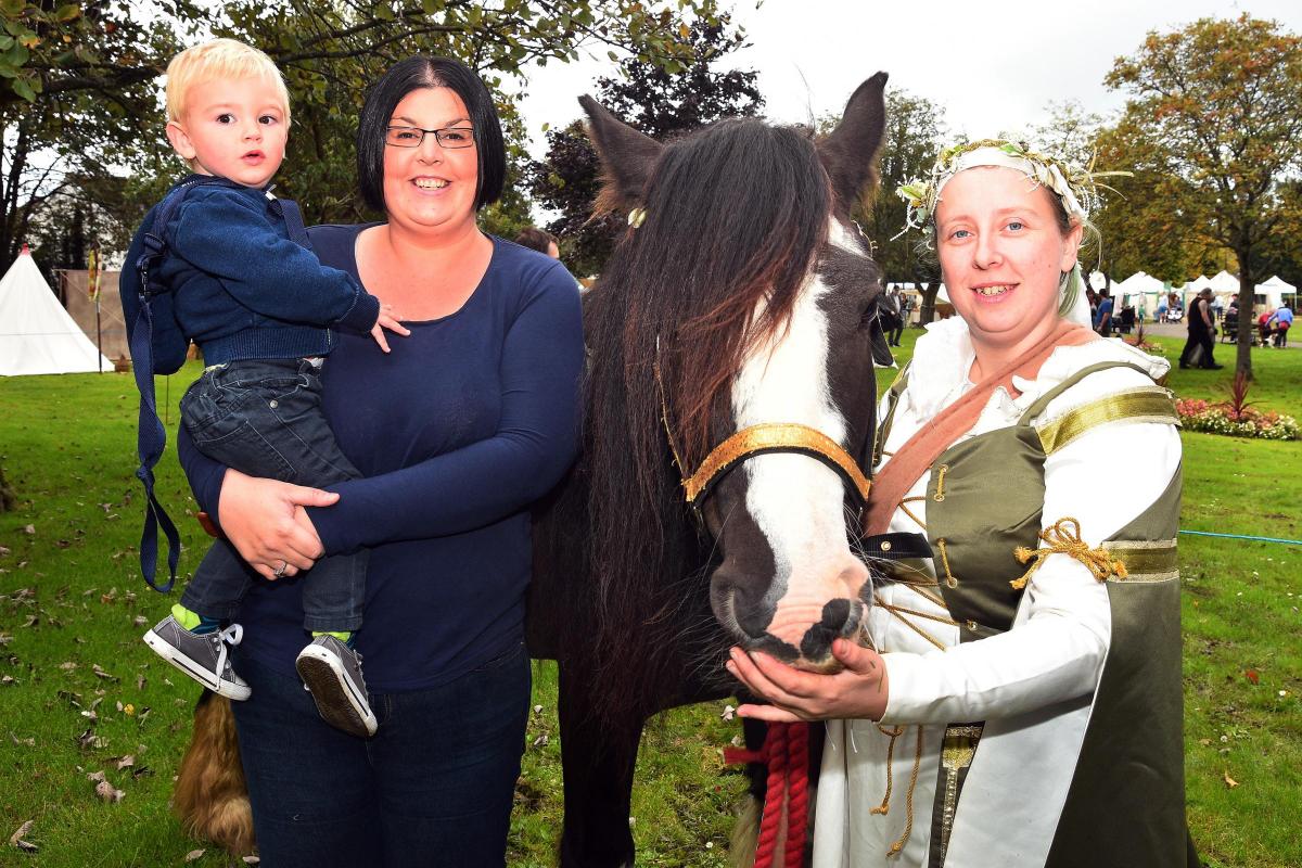 17 month old Ash and mum Jessica meet Hannah Cartwell and her horse Tank from the Brothers of Aman medieval re-enactors (Boars).  Pic Mark Davies