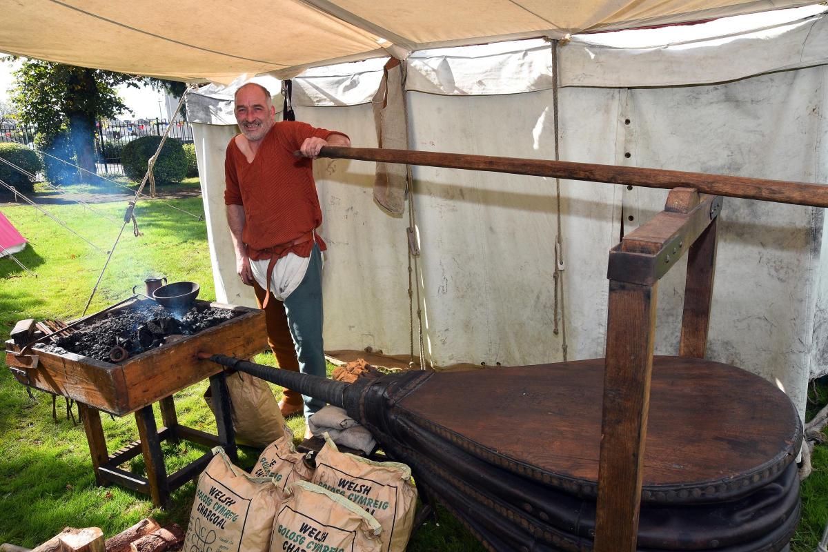 Gary Saunders works his antique bellows at the Three Ravens Forge.  Pic Mark Davies