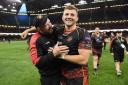 FIRST: Ceri Jones celebrates with Elliot Dee after the Dragons' first Judgement Day win