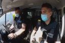 Two police officers in a van during Rookie Cops. Picture: BBC
