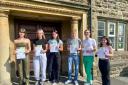 Ysgol Dyffryn Aman pupils celebrating their A-level results
