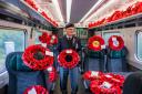 Veteran Melvin Rudge amongst the wreaths on one of the five trains from stations including Carmarthen which transported poppies to London Paddington for a memorial service