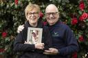 Linda and Pete Thornton with a portrait of their son  Lt John 'JT' Thornton RM