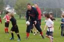 REDS ON THE ROAD: Rhys Priestland gets stuck in at Burry Port RFC as part of Scarlets' Community Roadshow. Pic: Riley Sports Photography