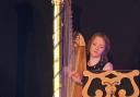 Alis Huws performing on the royal harp