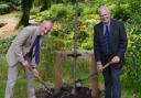 Peter Burgess and Phil Ratcliffe planting the tree