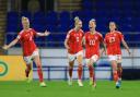 Ffion Morgan (right) joins in the celebrations as Fishlock scores the winner for Wales. Picture: PA