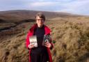 Jane Burnard with a copy of The Cry of the Red Kite