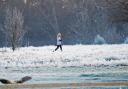 A jogger braves the icy conditions.