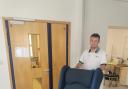Physiotherapist Scott Jakeman with the new chair. Picture: Hywel Dda Health Charities.