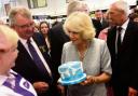 Camilla being presented with cake in 2013 from Little Velvet Cakery Academy