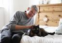 David Cryer and his cat Beau who reached the final of Marvellous Moggy in the Cats Protection National Cat Awards. Picture: PA Media
