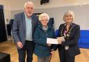 Former chair of Llandybie Community Council Carey Thomas (right) has listed six ways that life has improved for the community.