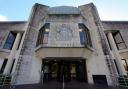A man appeared at Swansea Crown Court accused of a number of charges against a woman.