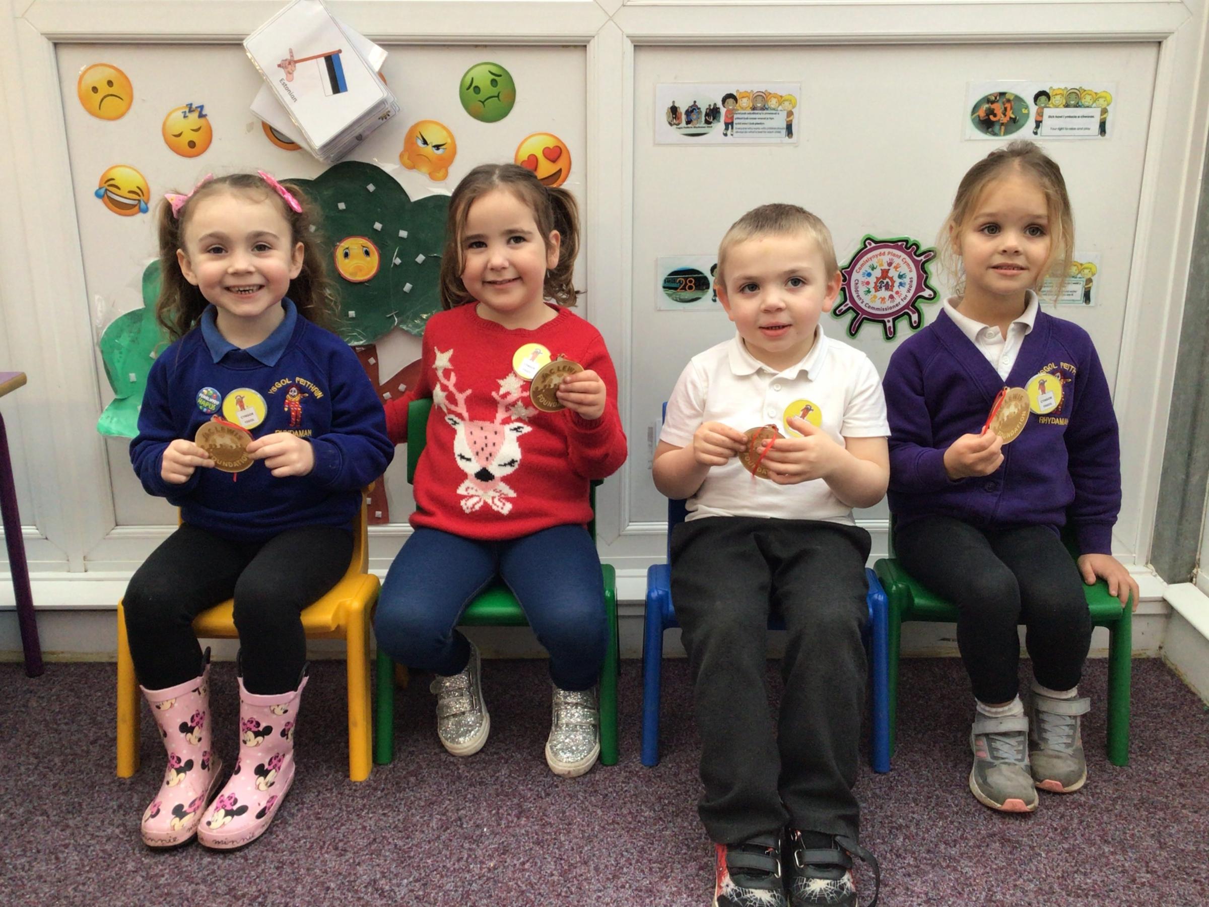 The youngsters at Ammanford nursery were gifted medals to thank them for their fundraising efforts