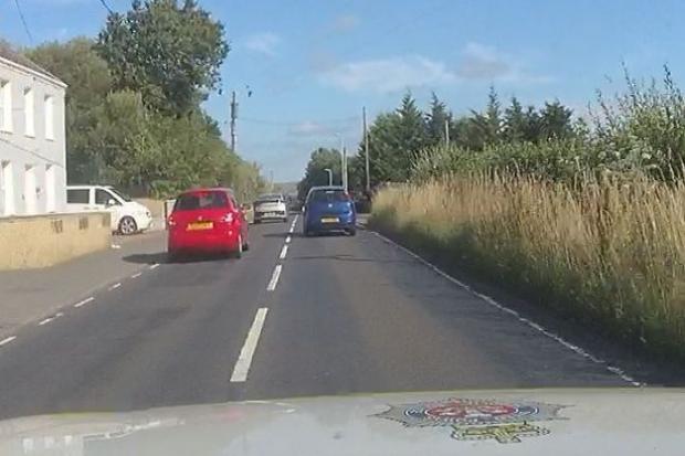 Nathan Jeffries blue car (on the right), led police on a 70 mph chase through Ammanford
